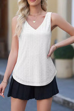 White eyelet knit patterned sleeveless top with a loose v neck perfect for casual summer wear