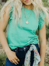 Teal eyelet lace ruffled cap sleeve top with delicate lace ruffles on sleeveless shoulders for elegant wear