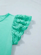 Mint green eyelet lace ruffled cap sleeve top featuring delicate eyelet lace ruffle sleeves for a stylish look