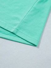 A soft mint green cotton eyelet lace ruffled cap sleeve top with neatly stitched seams