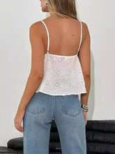White eyelet lace trim cami crop top with thin straps featuring floral eyelet lace design for summer wear