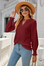 Eyelet Notched Lantern Sleeve T-Shirt in maroon with jeans and hat