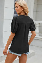 Women’s black short-sleeve Eyelet Notched Puff T-Shirt with textured finish