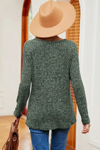 Woman in eyelet ribbed round neck long sleeve sweater with jeans and hat