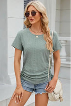Eyelet round neck short sleeve women’s knit top with ruched sides