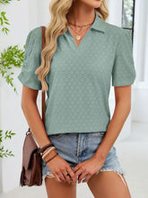 Mint green eyelet short sleeve polo shirt with subtle diamond-patterned eyelet design for stylish comfort