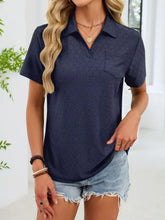Navy blue eyelet short sleeve blouse with subtle textured pattern and chest pocket in a lightweight fabric