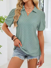 Soft sage green eyelet short sleeve blouse with subtle diamond pattern and classic collar in breathable fabric