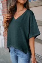 Women’s dark green V-neck dropped shoulder short-sleeve eyelet T-shirt with jeans