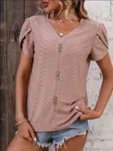 Light pink eyelet V-neck top with petal sleeve and decorative buttons