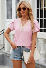 Pink eyelet top with petal sleeve and lace-trimmed V-neck