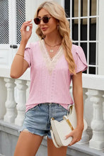 Women’s pink eyelet short-sleeve top with cream lace V-neck and petal sleeve