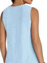 Light blue eyelet v neck neck tank with sleeveless design and textured perforated knit pattern