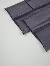 Dark gray terry knit flower patch mineral washed denim pants with relaxed fit and visible seam stitching
