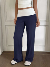 Navy blue wide leg pants with a white elastic waistband designed for a perfect fit and comfortable wear