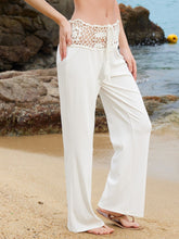 Cream-colored wide leg pants featuring an intricate crochet waist wide lace waistband and a drawstring tie closure