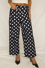 Black mid-rise wide-leg trousers with bold white polka dot print and patched pockets perfect polka dot pants