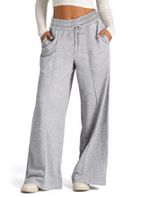 Gray heathered drawstring wide leg pants with a waistband and side pockets suitable for casual wear and care instructions