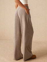Beige corduroy drawstring wide leg pants with relaxed fit and side pockets for comfortable casual wear