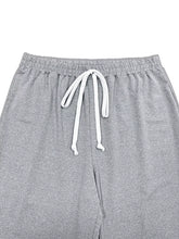 Plus size striped contrast wide leg pants in gray heathered fabric with white drawstrings for comfortable wear