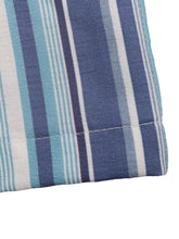 Striped wide-leg pants in quilted fabric with vertical blue white and light teal stripe pattern ideal for flat sandals