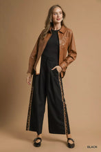 Umgee front pleated wide-leg black pants with leopard print contrast trim side stripes offer stylish comfort
