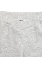 A soft heather gray hooded sweatshirt with subtle textured fabric and stitched neckline styled with high waisted flare leg pants