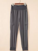 Gray elastic high waist pocketed cargo jogger pants with side pockets and ribbed cuffs for casual wear