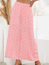 Pink wide leg pants featuring a white polka dot pattern perfect as stylish polka dot wide leg trousers