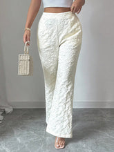 White lace-patterned textured high waist wide leg trousers with a flared leg design for elegant wear