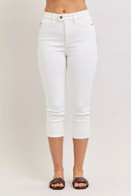White denim judy blue capri pants with extended waistband spade pockets and classic button closure