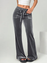Gray velvet flare pants with drawstring waist and front pockets offering stylish comfort in velvet flare design