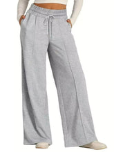 Gray heathered drawstring wide leg pants with elastic waistband and soft fabric care instructions included
