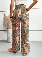 Beige red and green paisley-patterned wide leg pants with elastic waistband perfect for casual wear