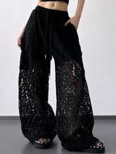 Black lace wide leg pants with sheer textured fabric and drawstring waist for elegant wide leg pants style