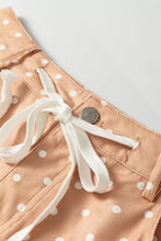 Beige polka dot print drawstring wide leg shorts with white waistband and silver button for casual wear