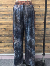 Full size tie-dye wide leg casual pants in dark blue and black with a reddish-brown elastic waistband for plus size wear