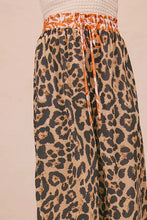 BiBi leopard print wide-leg pants in orange beige and black with elastic waistband and matching drawstring