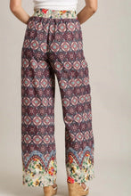 Umgee full size mixed print elastic waistband pants in vibrant purple pink teal and cream with geometric floral motifs
