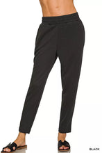 Black zenana scuba capri sweatpants made of soft fabric with elastic waistband tapered legs and pocket detail