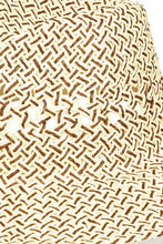 Close-up of Fame cutout woven straw hat with intricate openwork
