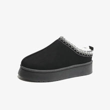 Faux fur lined black suede platform slip-on mule with white zigzag stitching