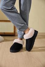 Black faux fur round toe platform slippers with textured sole
