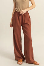 Cropped rust-colored wide-leg pants with elastic waistband from hyfve designed for comfort and easy care instructions