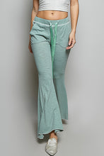 Light green ribbed knit flared pants with matching drawstring waistband made from ribbed knit fabric by pol