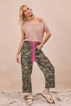 BiBi braided waist belt camouflage print pants with relaxed fit, patch pockets, and bright pink drawstring waistband