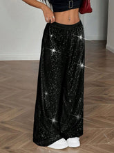Black sequin wide leg pants with stretchy elastic waistband featuring shimmering sequins and comfortable fit