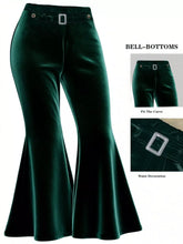 Plus size emerald green velvet flared pants featuring bell-bottom design and a sparkling silver rectangular buckle waistband