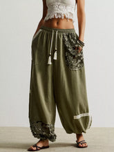 Olive green lace detail drawstring harem pants with wide-leg fit and tassel waistband for comfortable style