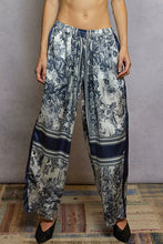 Pol floral printed woven wide leg drawstring pants in lightweight fabric with blue white pastoral print and navy hem stripes